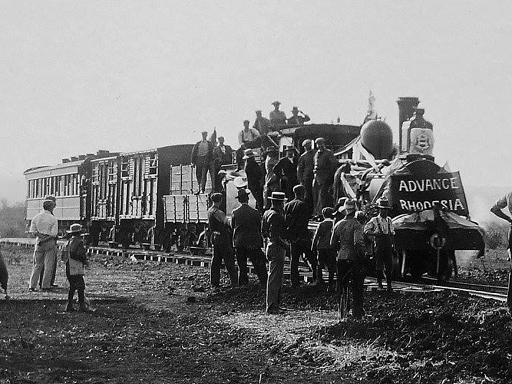ed_1897_railways_first_train_advance_rhod.PNG